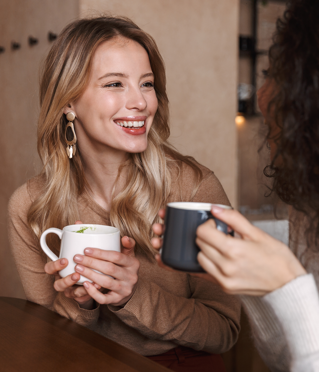 women drink coffee