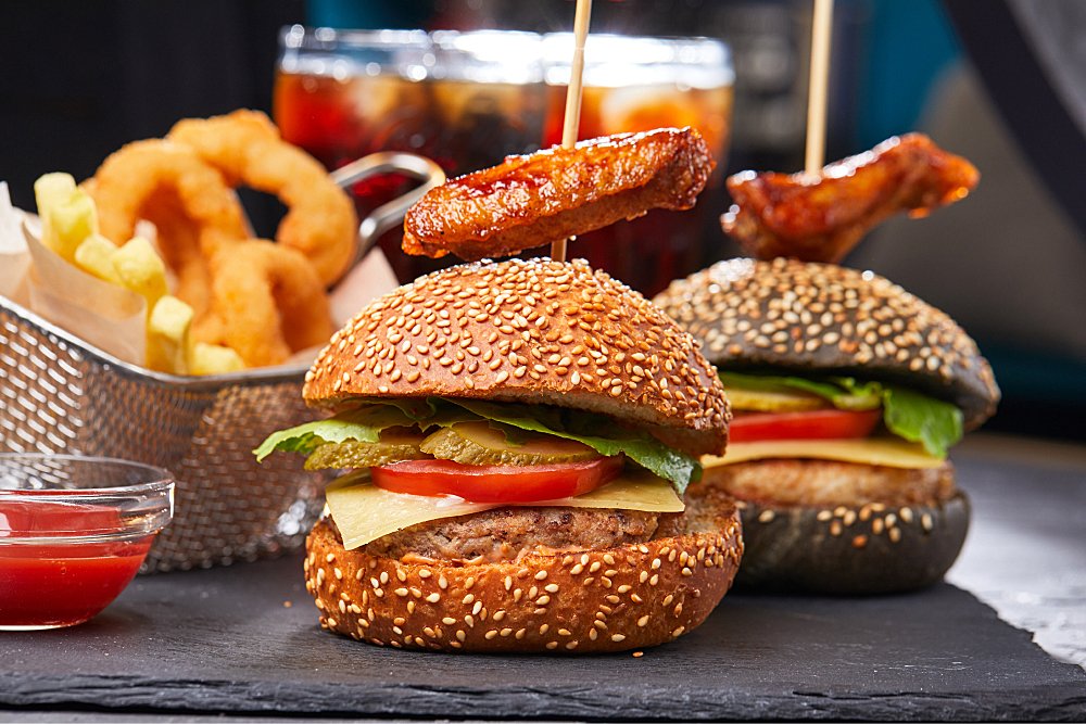 two burgers wih onion rings